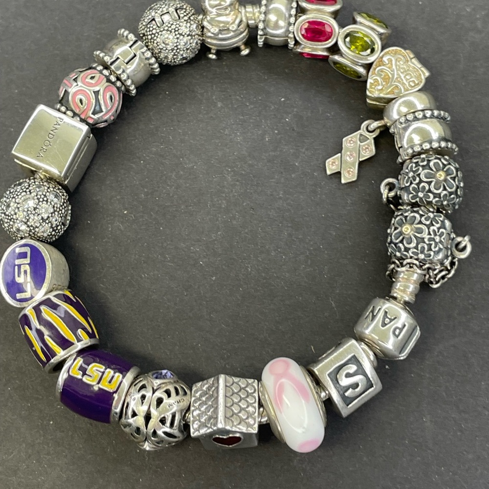 Completed Pandora charm bracelet featuring rare and retired charms.